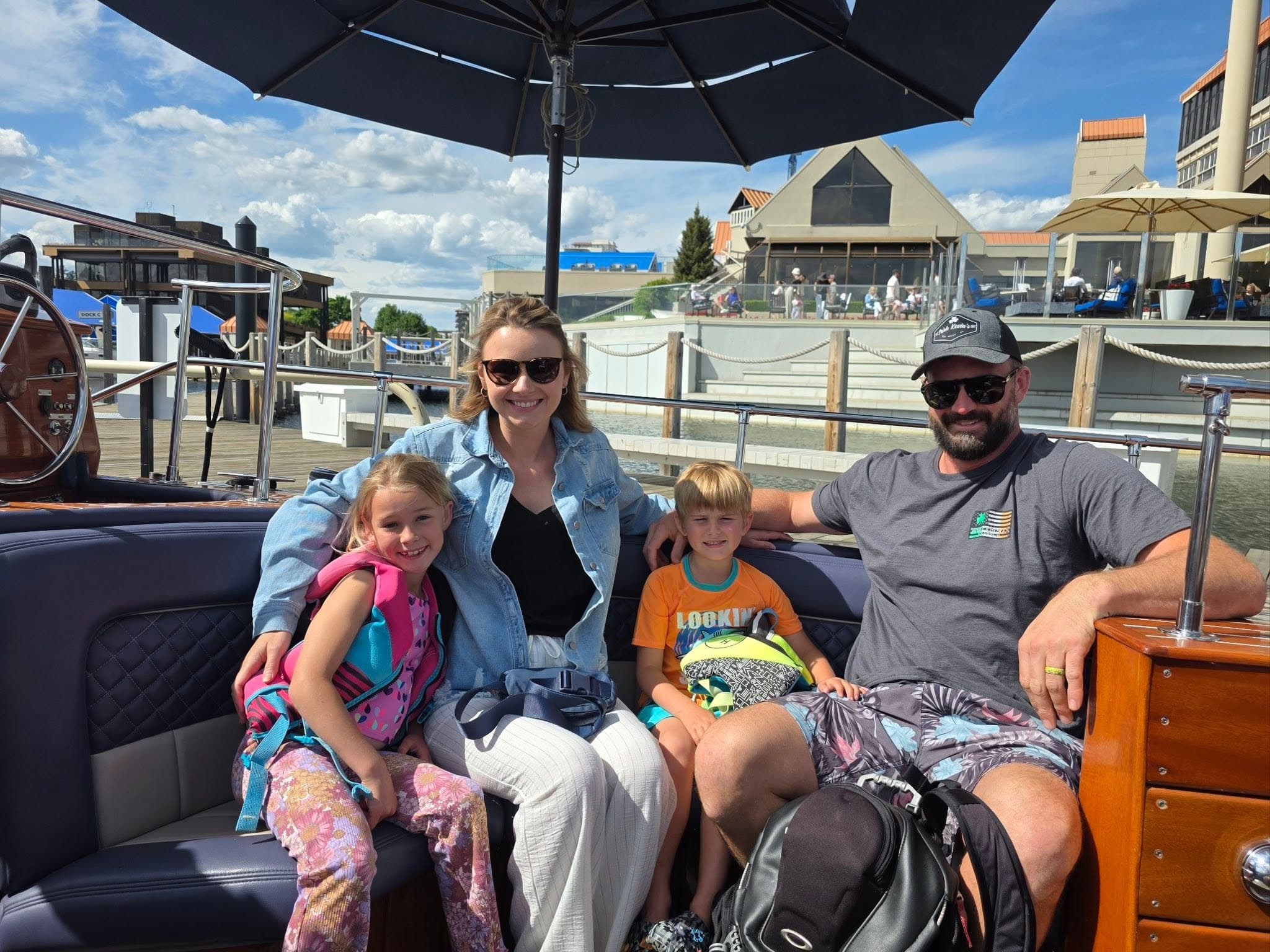 Taylor and Alexander with the kids on a boat